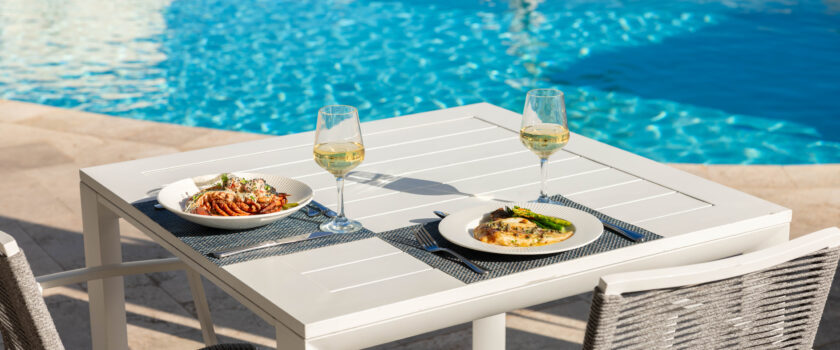dining table by pool.
