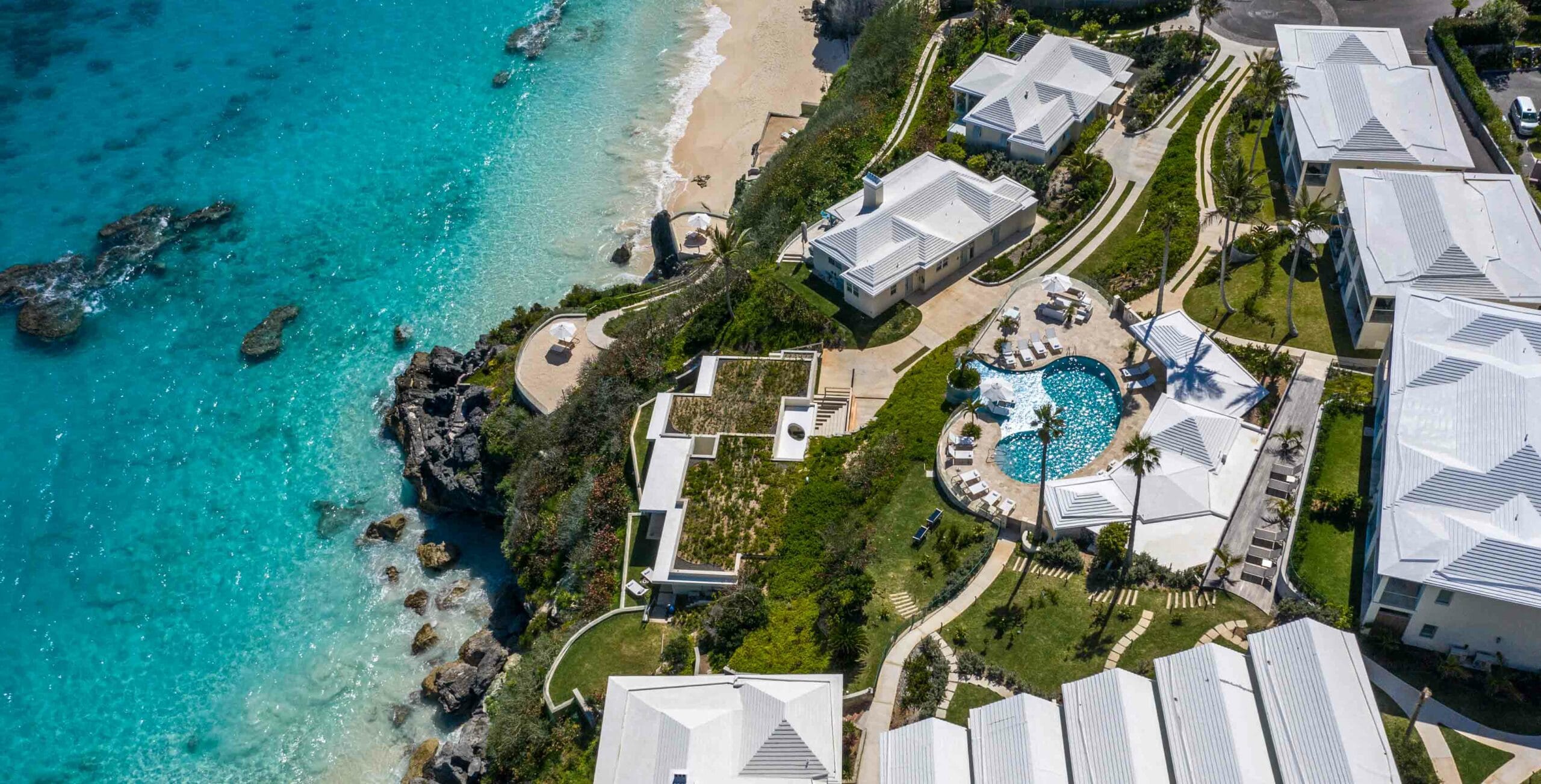 An aerial view of Azura Bermuda and the ocean.